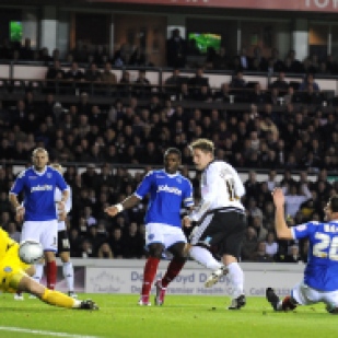 Derby County's Kris Commons scores against Portsmouth.
