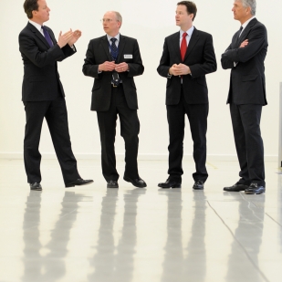 David Cameron and Nick Clegg with Rolls-Royce director John Griffiths, and chief executive John Rose.