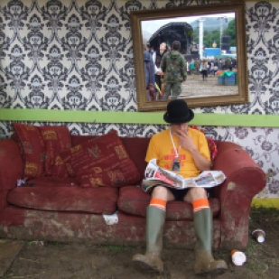 Taking a break from the mud at Glastonbury Festival.