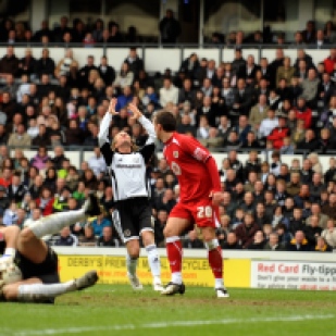 Derby County's Robbie Savage laments a save by Bristol City's Adriano Basso.